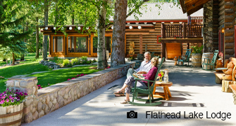 Couple sitting on porch of main lodge